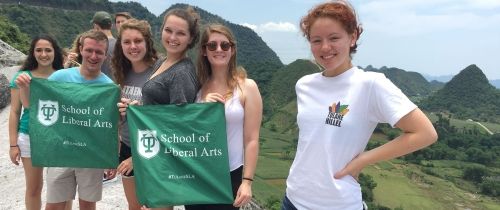 tulane university students on hike asia flags