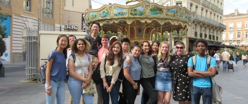 High school students in front of a carousel in Toulouse