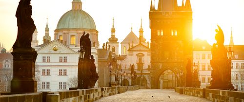 Prague Charles Bridge statues at sunrise