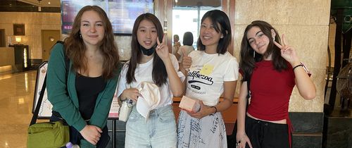 High school summer abroad students posing in front of elevator