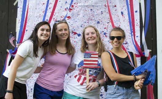 four students celebrating july fourth usa