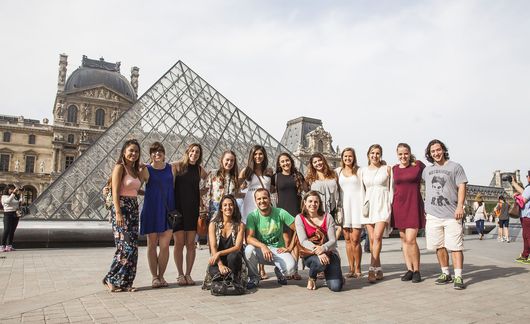 Paris group of students at the Louvre Pyramid