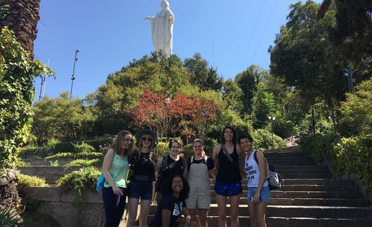 students by statue in santiago chile park