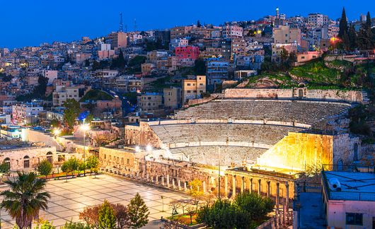 roman amphitheater at night in amman, jordan