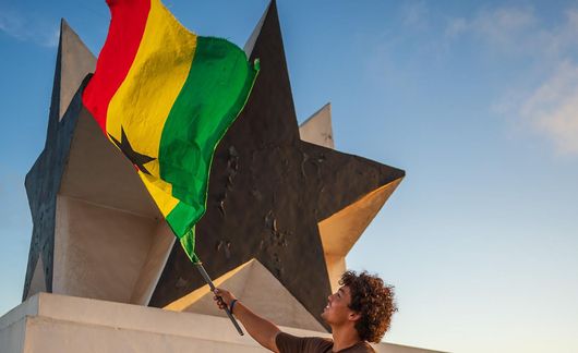 legon-guy-waving-flag-black-star