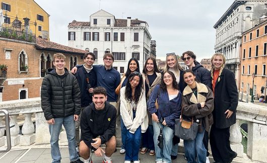 milan-student-group-posing-bridge