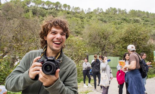 seville-smiling-guy-camera-hiking