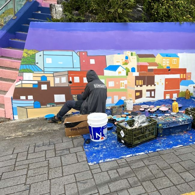We saw an artist painting a mural in Gamcheon Village as we were touring and it was so lovely to see how vibrant the artist community is in the village and Busan.