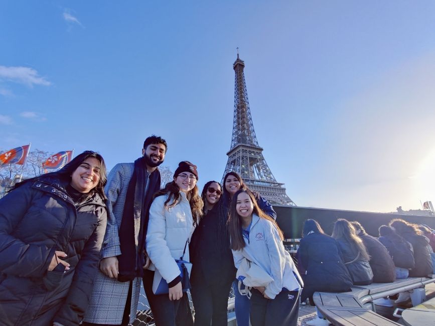 Students posing in front of the Eiffel Tower