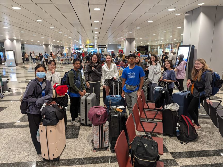 High school students waiting to get on a plane to Singapore