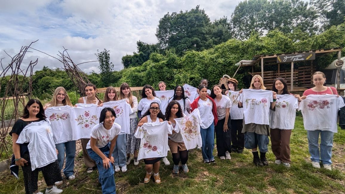 The students pose with their finished floral t-shirt designs