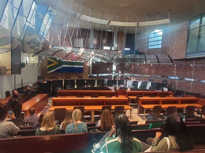 students sit inside the highest court in South Africa, Constitution Hill 