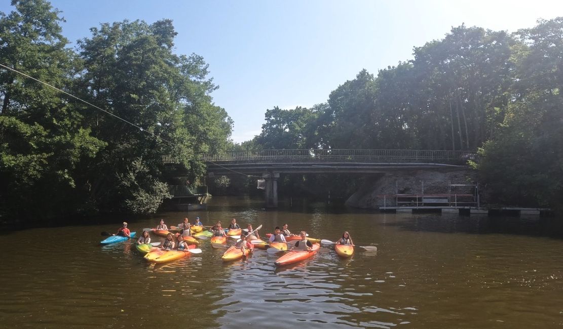 Kids kayaking on a river