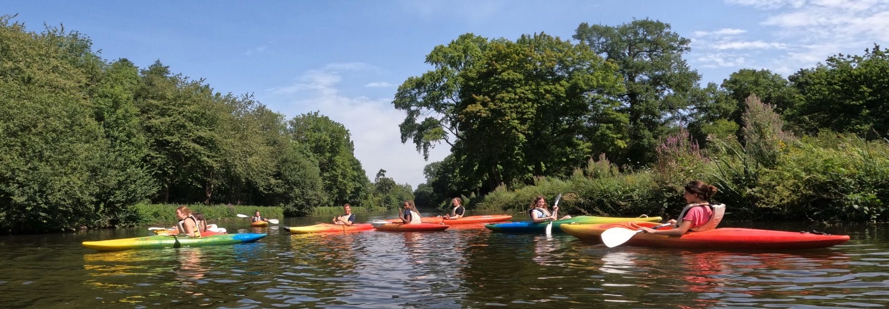 Kids kayaking on a river