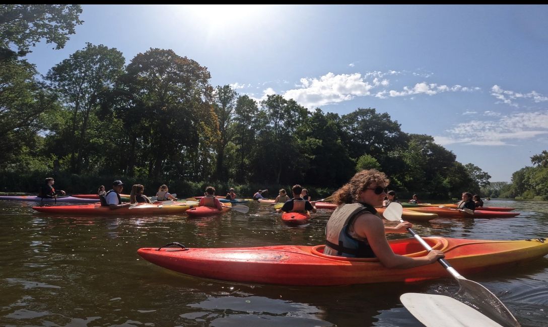 Kids kayaking on a river