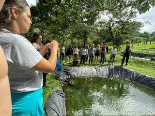 Students get a tour of the the water that is used to irrigate the farm. 