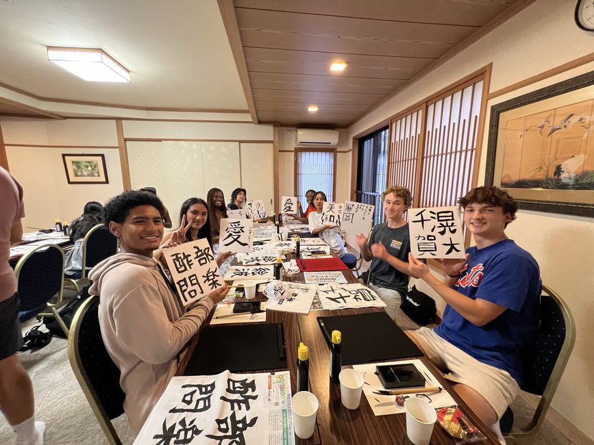 Students posing with their finished Shodo