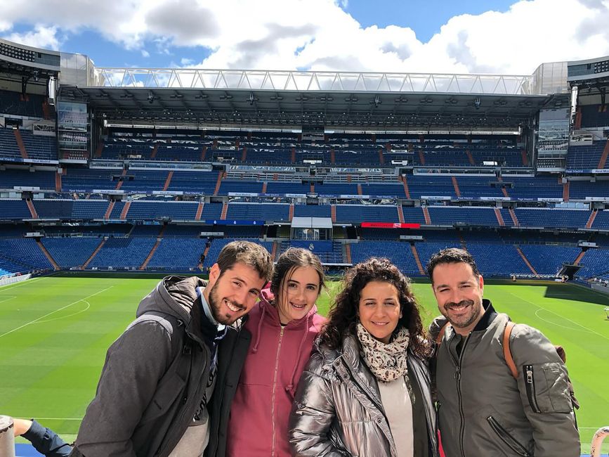 Student on football field with host family