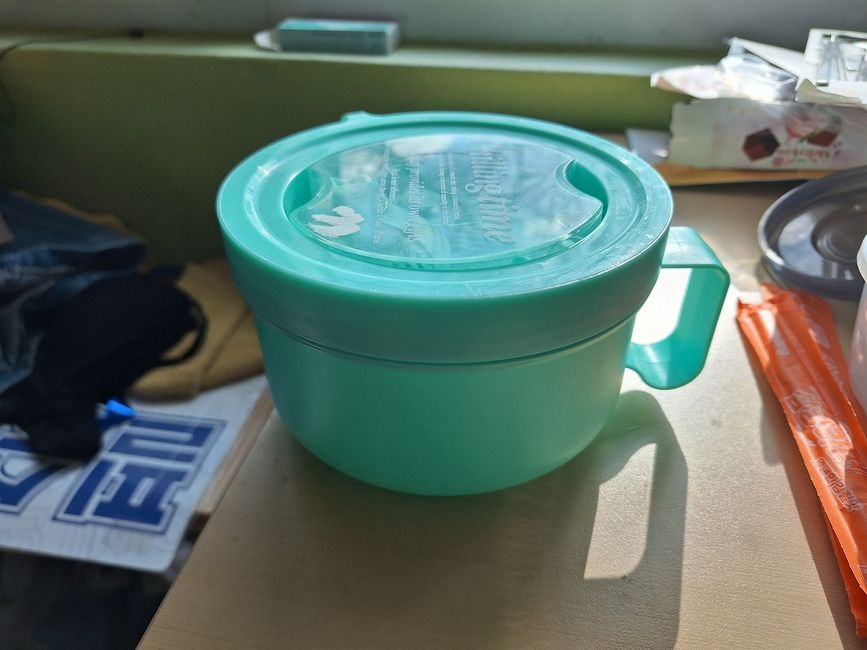 A picture of a bright blue soup container Tupperware