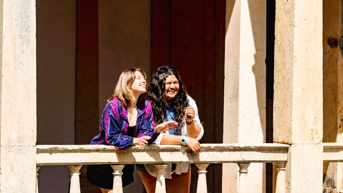 Students leaning against balcony at Convent in Portugal