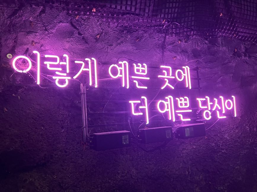 another led light in the wine cave; it reads: "in this pretty place, you're prettier"