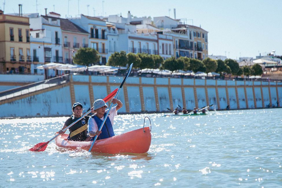 Students kayaking on a river in Seville