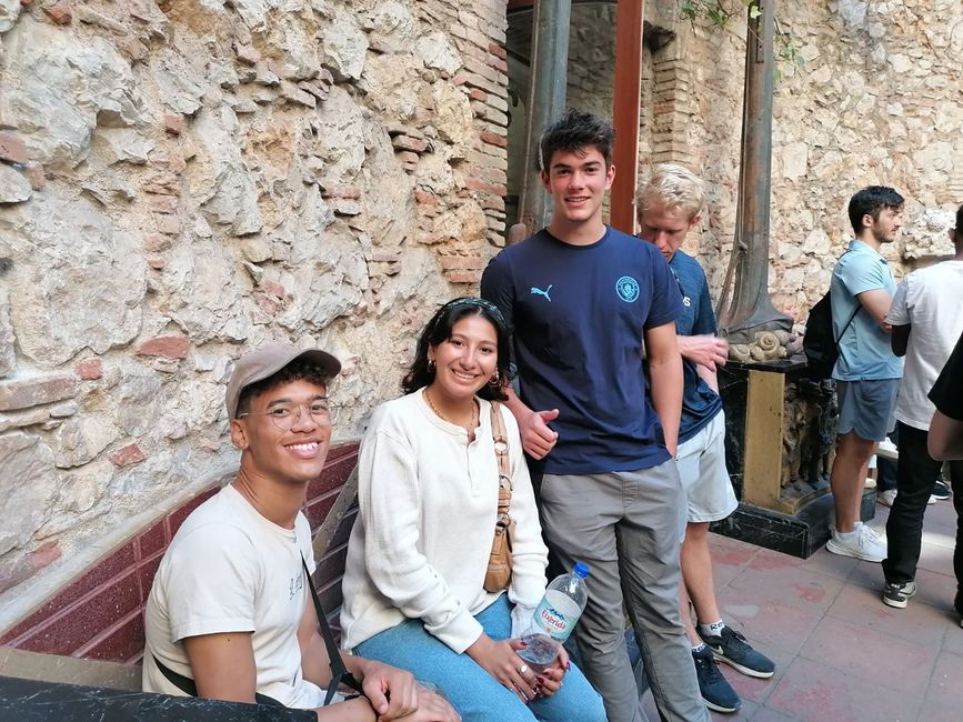 Students posing on bench outside museum in Besalu