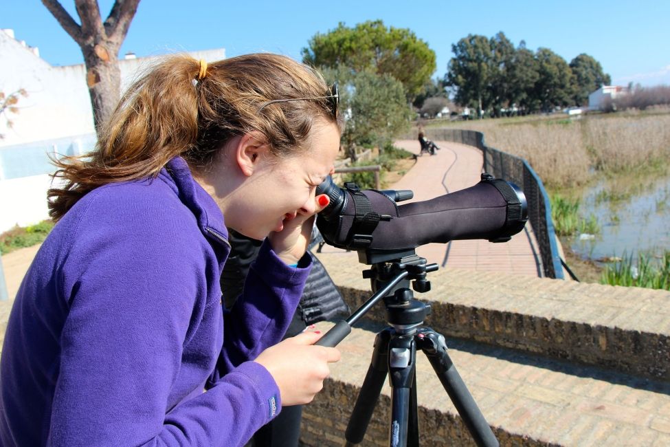 Gap year student in Seville looking through a camera lens