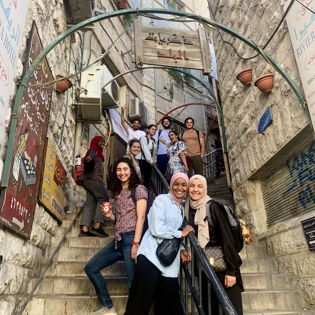 amman students standing on one of the oldest staircases in the city