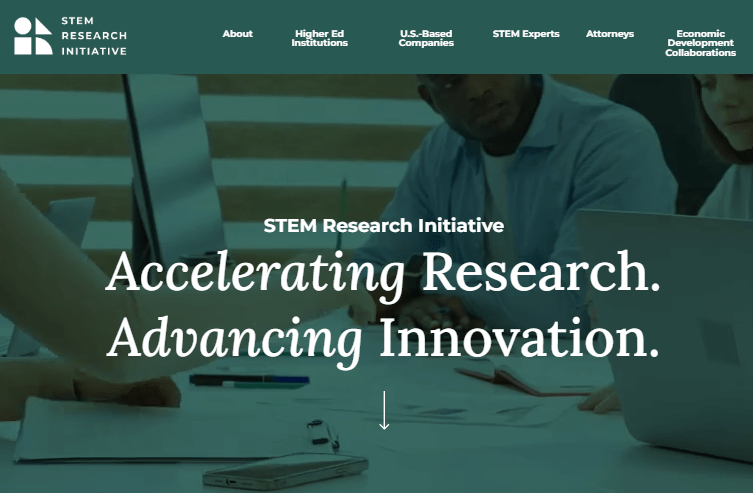 Screenshot of hero image on website of people behind laptop with green overlay and test that says "Accelerating Research, Advancing Innovation"