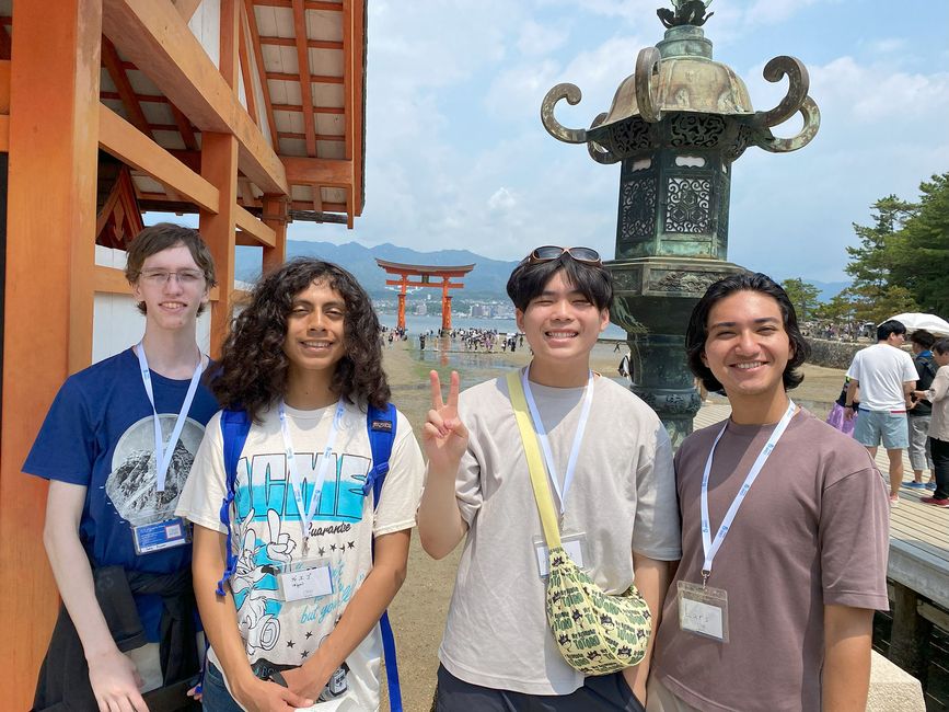 Kyoto students standing outside torii gate on Miyajima Island