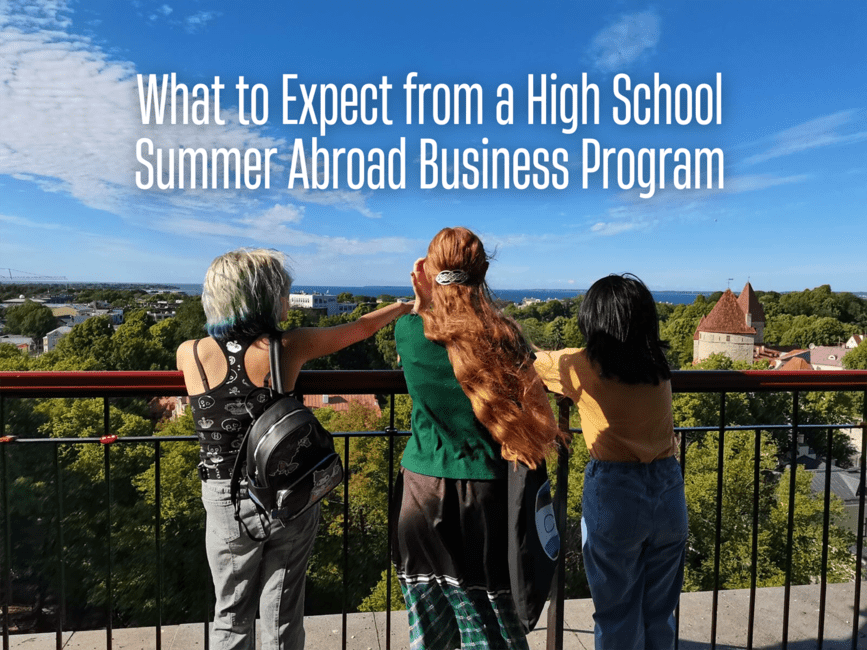 Students looking down at European cityscape from a balcony