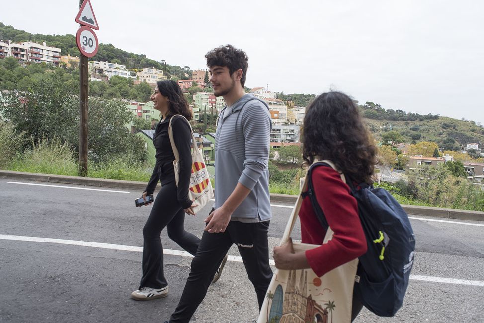 Teens walking down a street while studying abroad in Europe