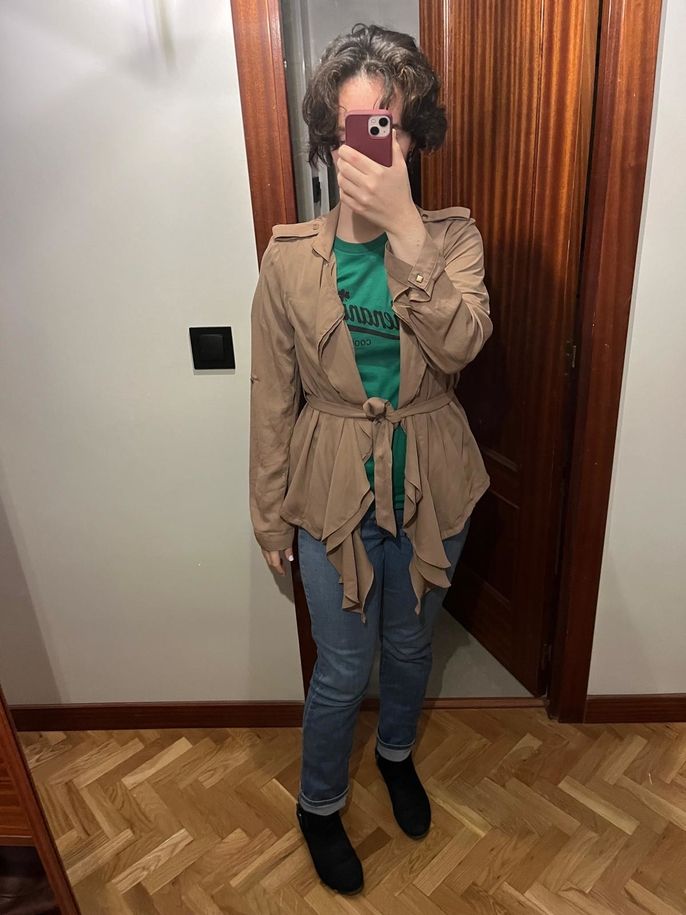 Green shirt, a tan jacket and jeans