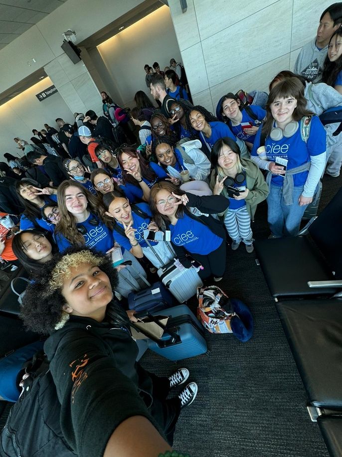 Eager faces ready to board the flight to Seoul!