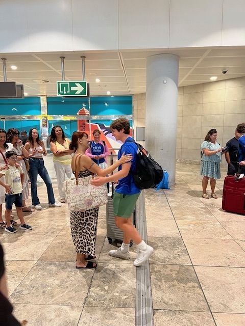 Student meeting their host family at Alicante airport
