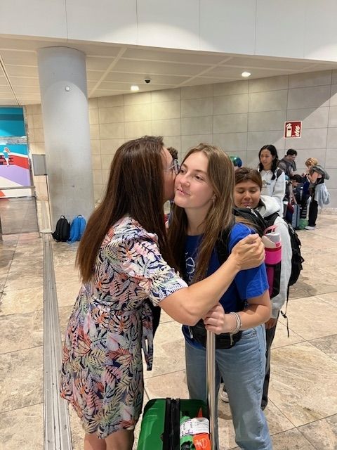 Two Spanish kisses as a greeting at the Alicante airport 