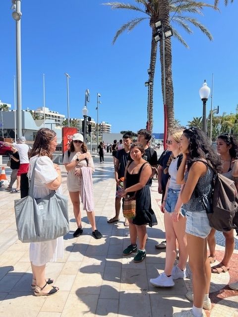 Students with academic director on walking tour