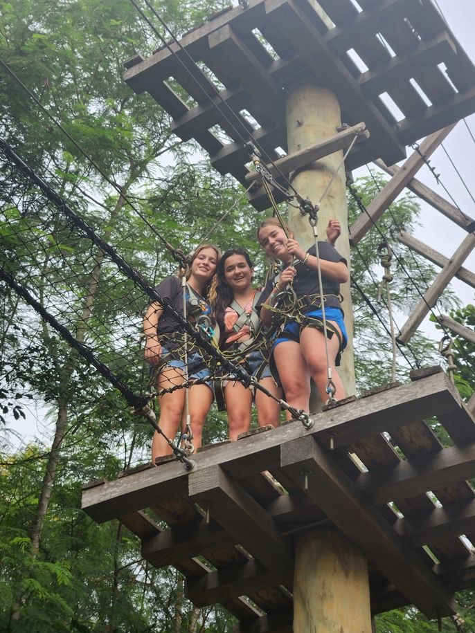 Jillian, Sara and Kirstyn pose on the rope courses at the Legon Botanical Garden