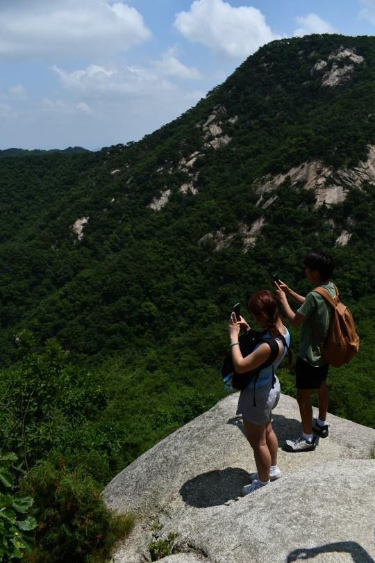 Image of people hiking trails of Bukhansan National Park.