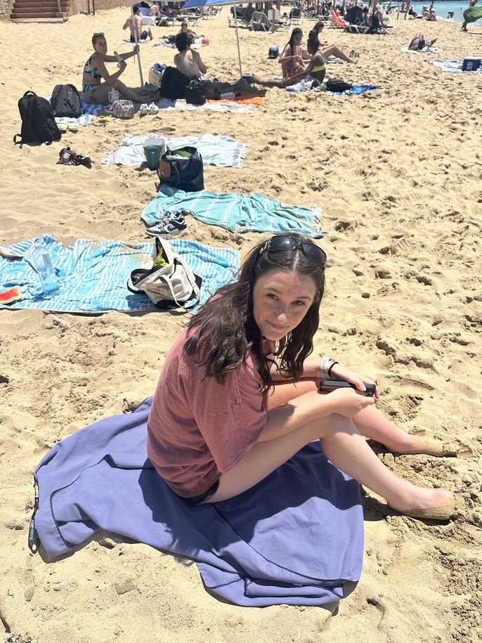 Female student chill on the beach