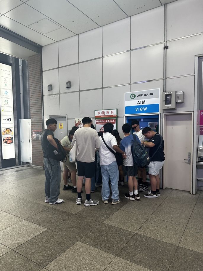 students at a stamp booth