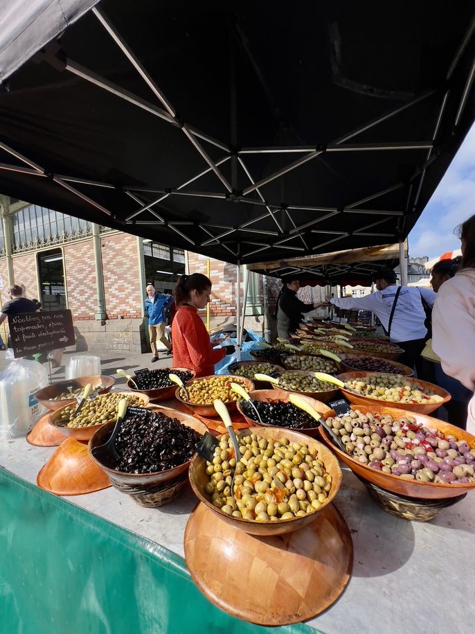 Pictures of various type of olives at an open air Market