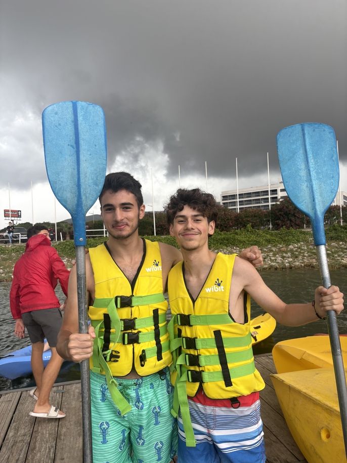 Two boys pose before they go canoeing. 
