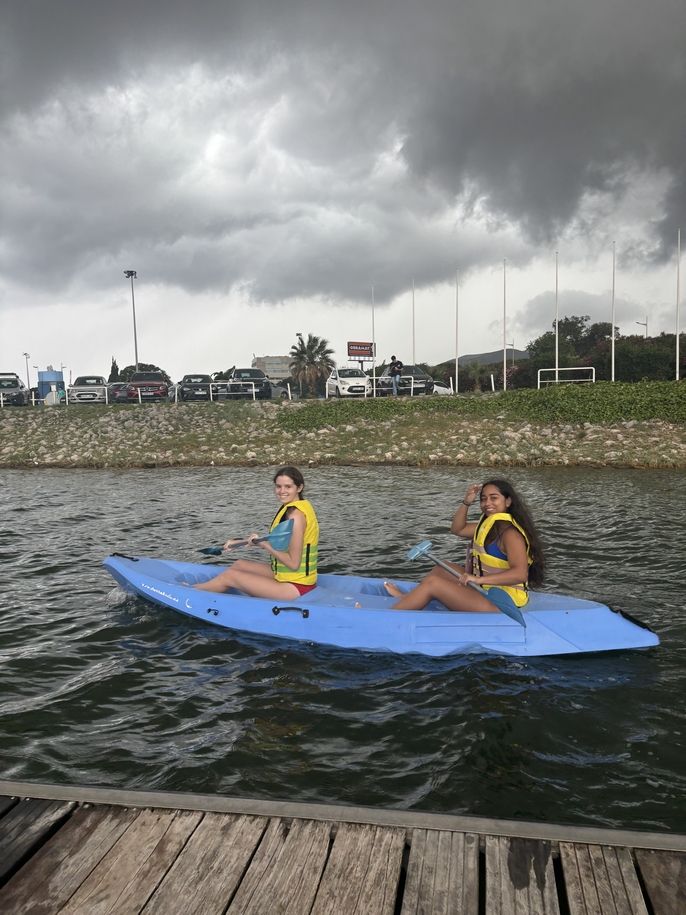 Two girls canoeing.