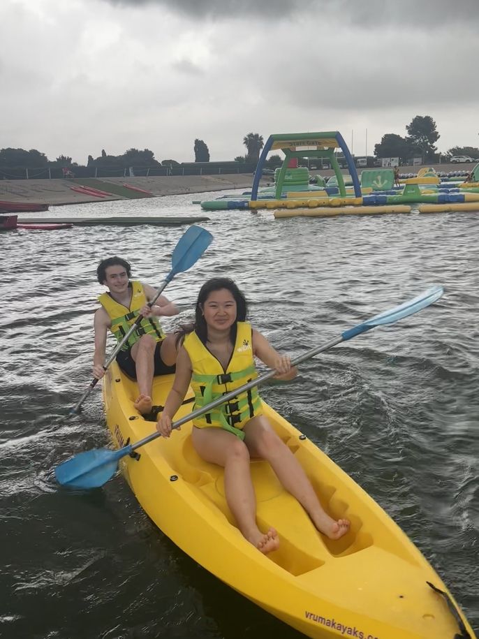 Two students go canoeing. 