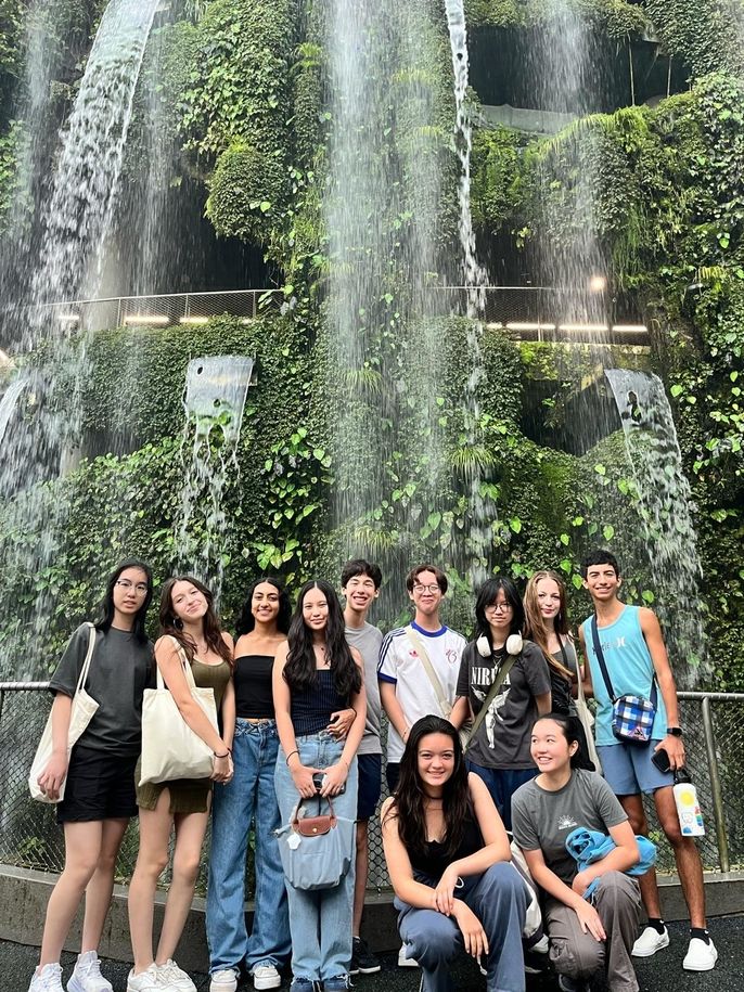 Group picture in front of waterfall