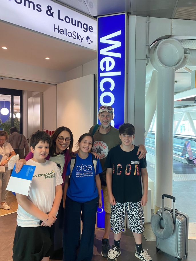 Student with host family at the airport in Rome