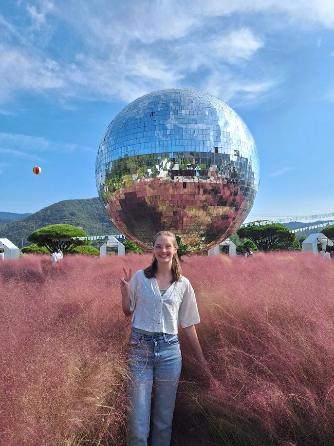 Sophie standing in front of the giant disco ball