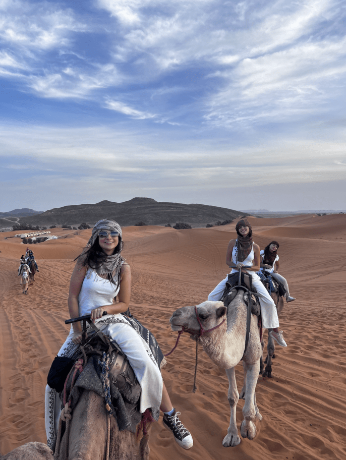 students abroad desert camel ride